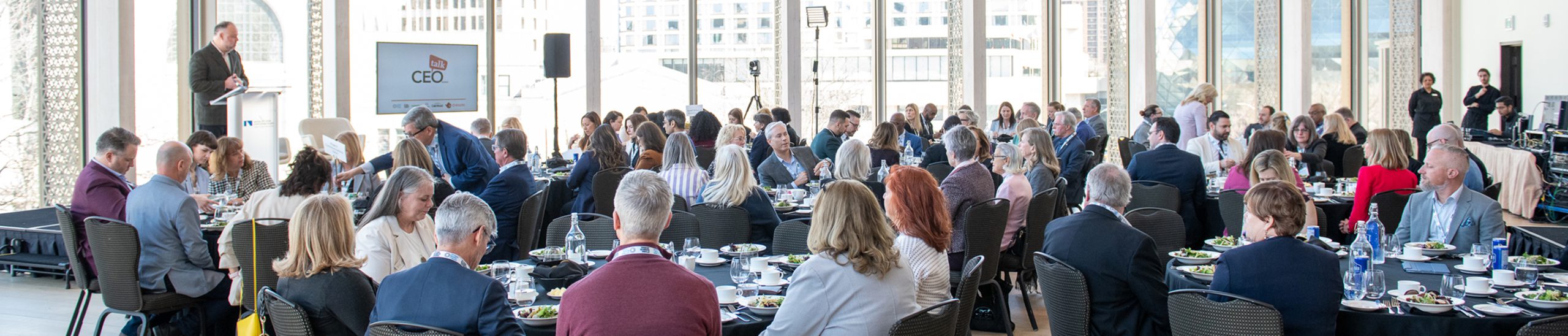 Ottawa Board of Trade meeting in a large conference room with large bright windows