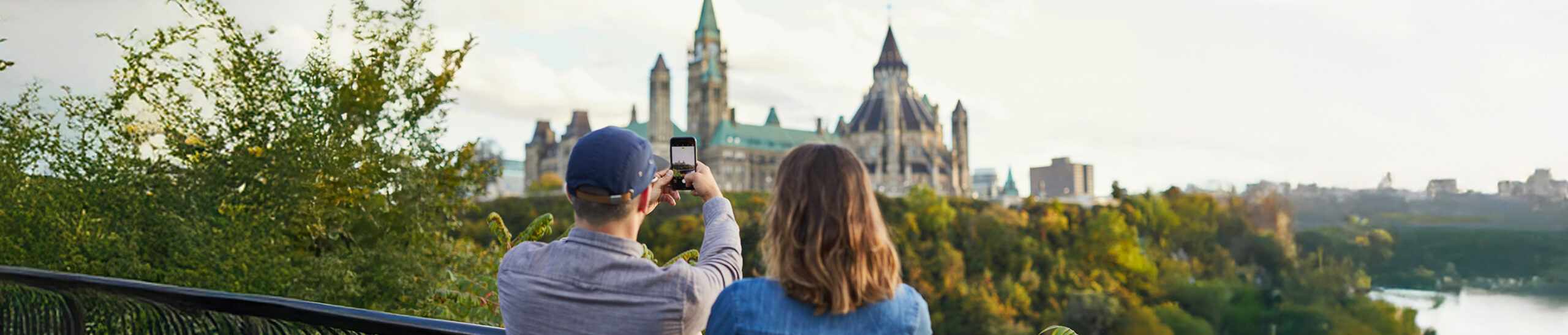 Couple taking image of the Ottawa downtown landscape