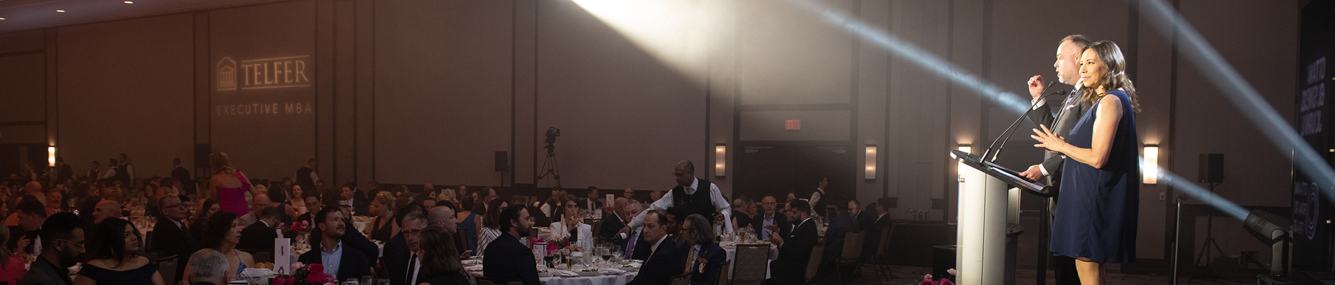 OBOT member speaking at a large gala